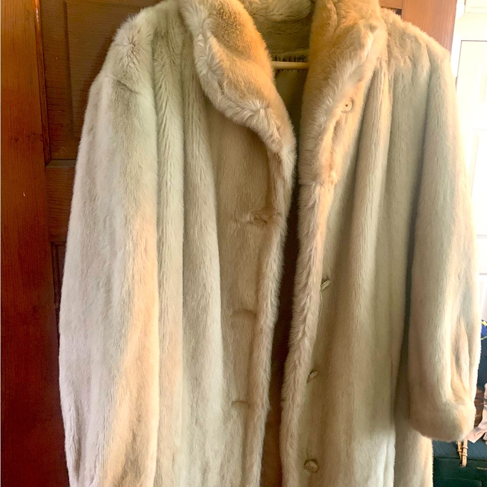 This 1960s faux fur honey mink coat is a Mincara by Russell Taylor.